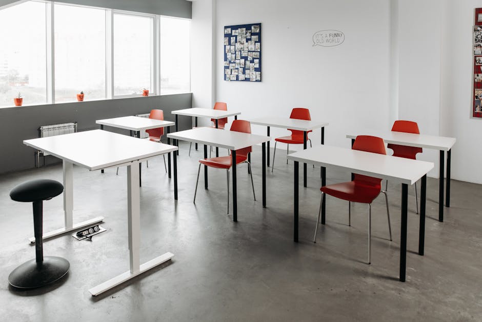 Bright classroom interior with red chairs and minimalist design, perfect for education themes
